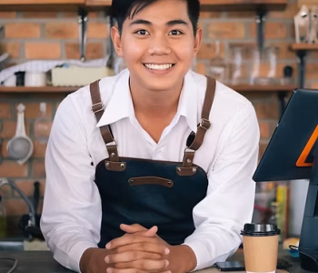 asian-male-barista-cafe-owner-looking-and-smile-a-2023-11-27-05-29-26-utc